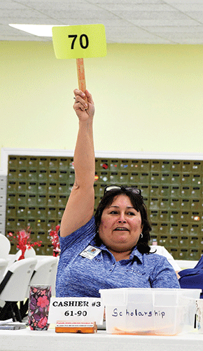 Auction Cindy with bid sign web