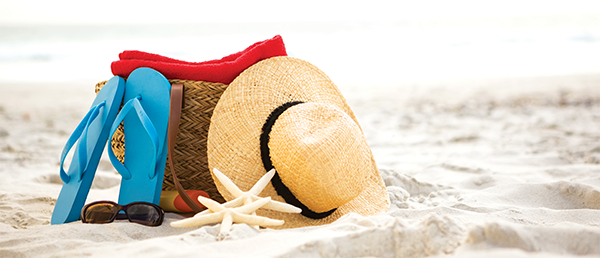bag and beach accessories kept on sand
